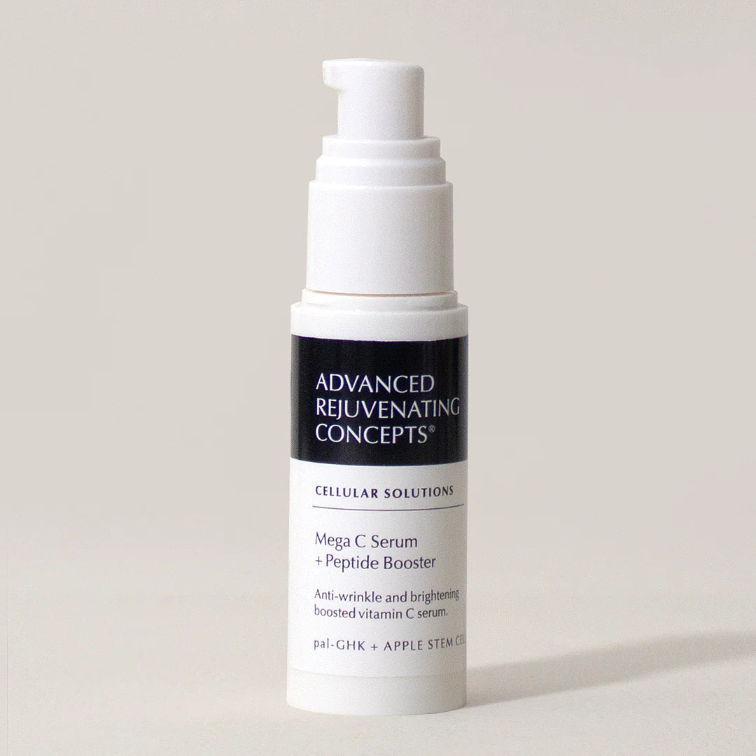 Mega C Serum with peptide booster in a white pump bottle for anti-wrinkle and brightening benefits.