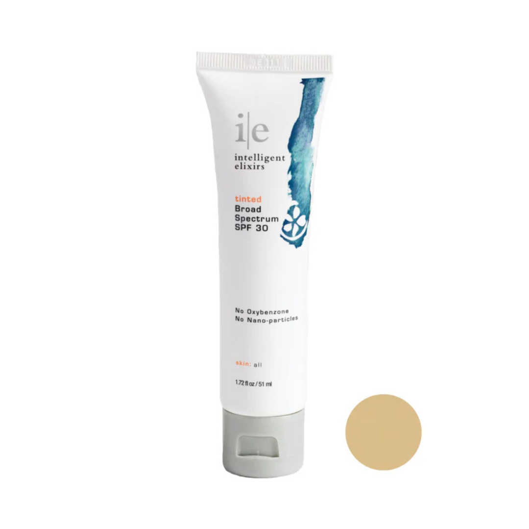 Tube of 'ile' sunscreen with a beige color swatch on a white background