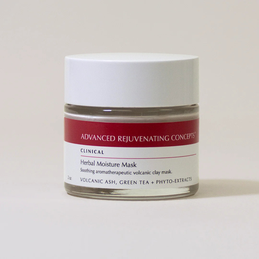 Herbal Moisture Mask in a clear jar with a red label, featuring volcanic ash, green tea, and phyto-extracts.