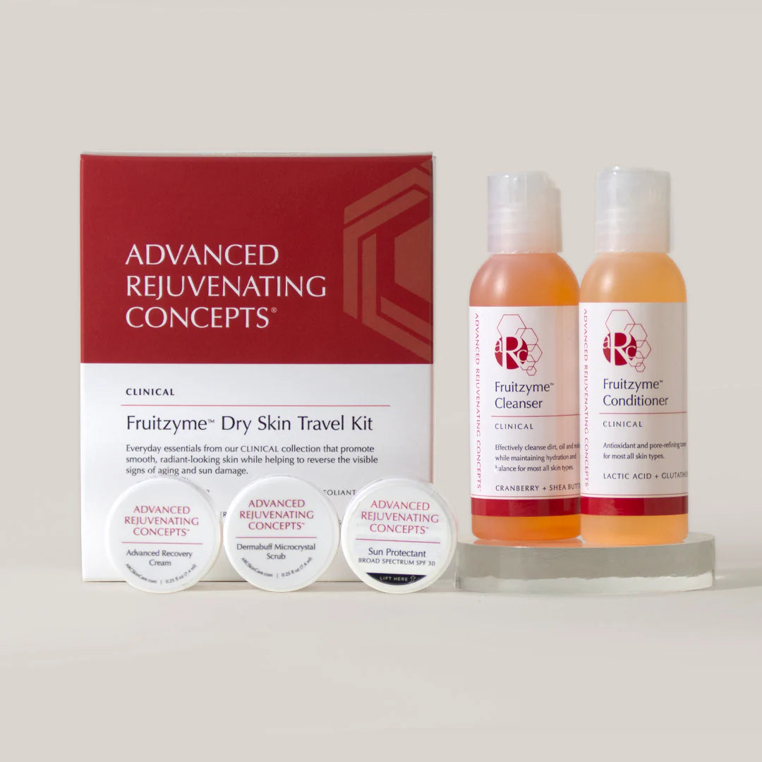 Fruitzyme Dry Skin Travel Kit with cleanser, conditioner, and samples for smooth, hydrated skin.