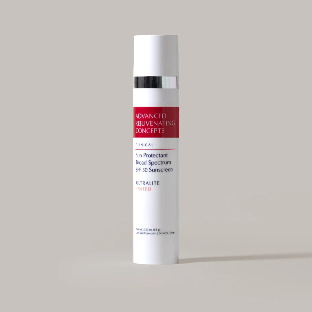 A pump bottle of Sun Protectant Ultralite TINTED, an SPF 50 sunscreen cream.