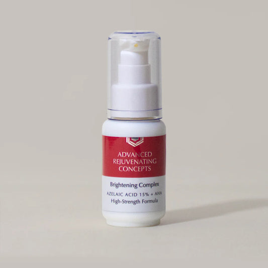 Lighten More Brightening Complex in a white bottle with a pump, featuring azelaic acid 15% and AHA.