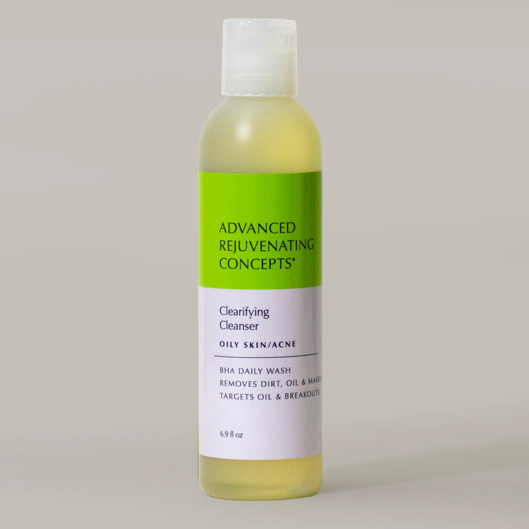Clarifying Cleanser in a clear bottle with green label, targets oil and breakouts for oily skin.