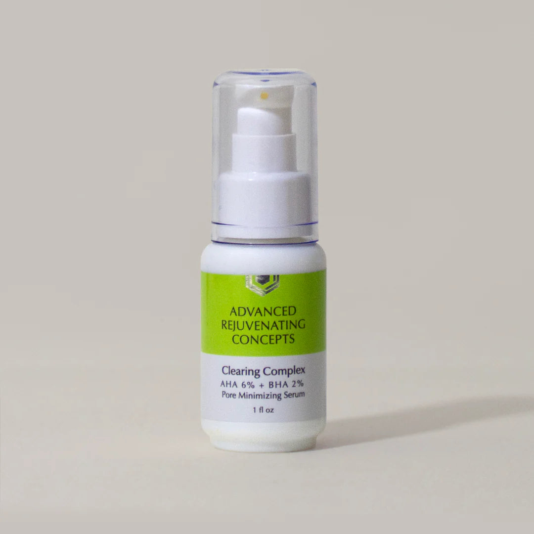 Clearing Complex pore minimizing serum in a white and green bottle, featuring AHA 6% and BHA 2%.
