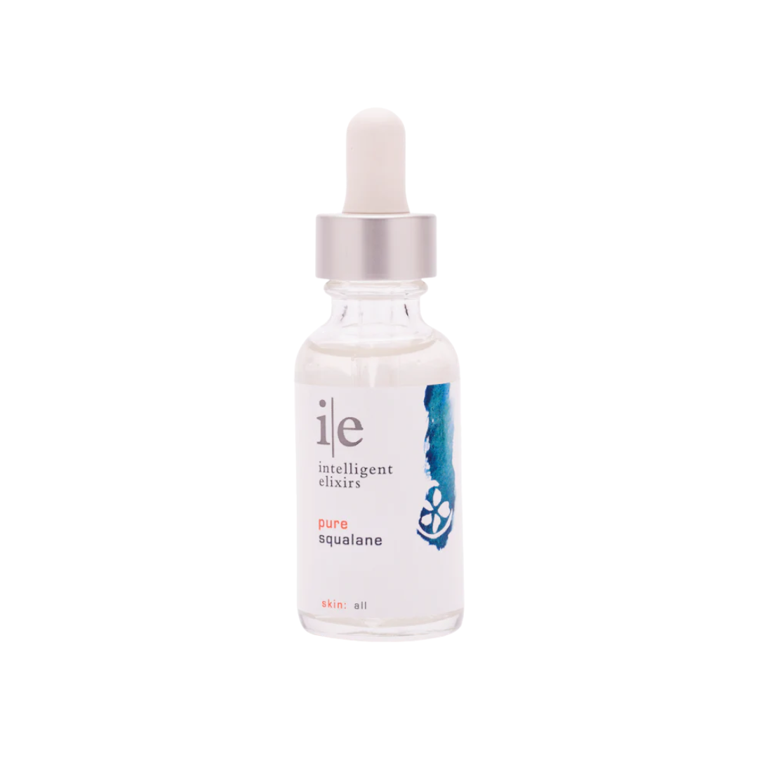 Pure Squalane serum in a clear glass bottle with a dropper and silver cap, suitable for all skin types.