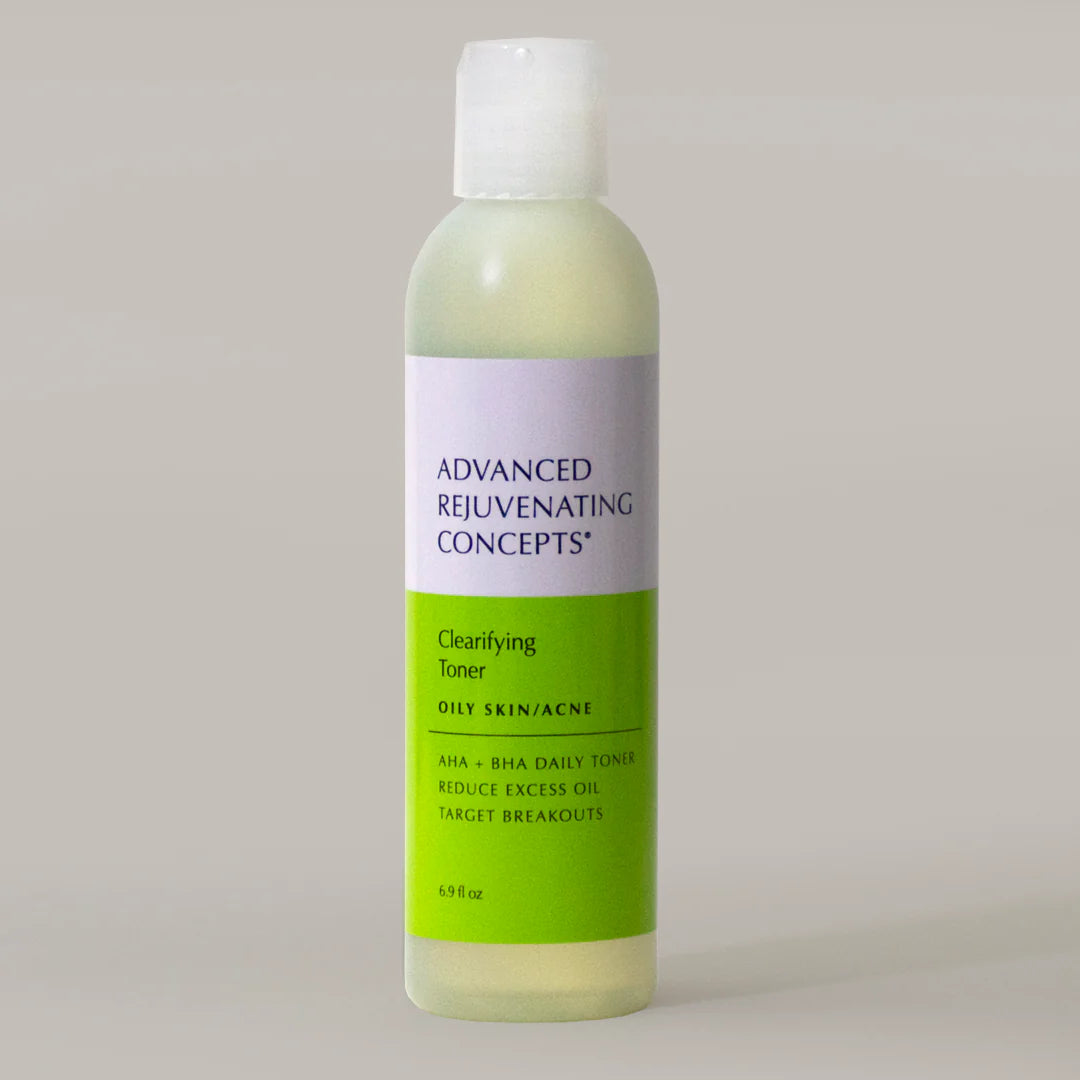 Clarifying Toner in a clear bottle with green label, designed for oily skin and acne treatment.