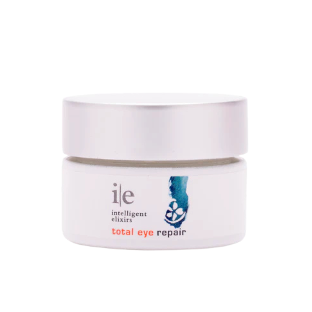 Total Eye Repair cream in a white jar with a silver lid, designed to rejuvenate and repair the eye area.